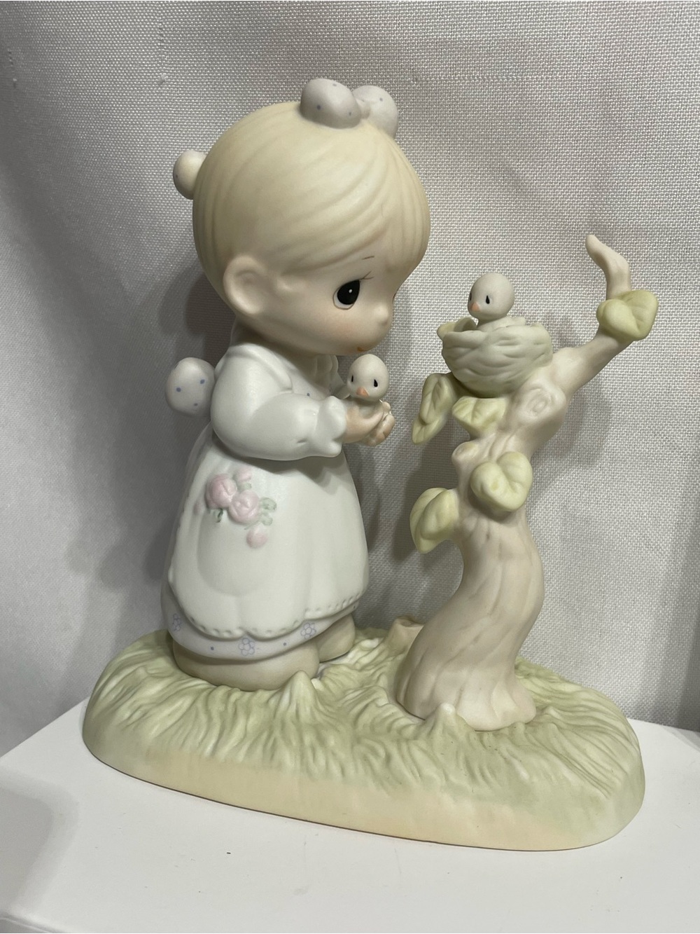 vintage Precious Moments figurine titled "His Eye Is On The Sparrow" (Model E-05